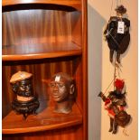 A quantity of collectables, comprising of two Italian cavalier puppets, a negro tobacco jar,