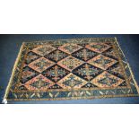 An antique Malayer rug, with allover dog tooth and diamond design with blue leaf border,