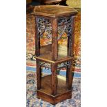 A Pugin Gothic style walnut three tier whatnot,