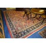 A Mahal carpet, with allover geometric floral design, over red ground with floral border,