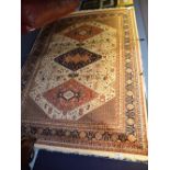 A Kashan motif carpet/wall hanging, the triple diamonds over cream ground with geometric decoration,