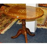 An Eastern inlaid pedestal table, the oval top with floral decoration,