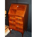 A lady's mahogany writing bureau, with drop flap slope enclosing fitted interior,