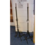 A pair of Victorian style wrought iron floor standing candle sconces, 109cm high,