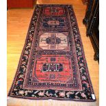 A Caucasian Kelleh rug, with four panels and floral border,