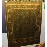 A Bokhara motif carpet/wall hanging, with five rows of 13 guls over green ground and borders,