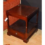 A mahogany two tier what not, the square top on block and ring turned supports,