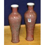 A pair of Chinese mottled glaze pottery vases, of tapering form, on red ground, 32cm high
