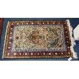 A Kashmir silk mat, with tree of life design and bird mihrab quadruple border,
