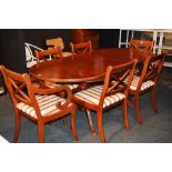 A reproduction Regency style dining room table, with six chairs, including two carvers,