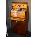 A mid 20th century walnut veneered cocktail cabinet,