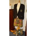 A dress kilt outfit, comprising of black jacket with order of the thistle badge,