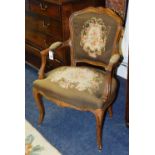 A French needlepoint open armchair, with foliate embroidered decoration,