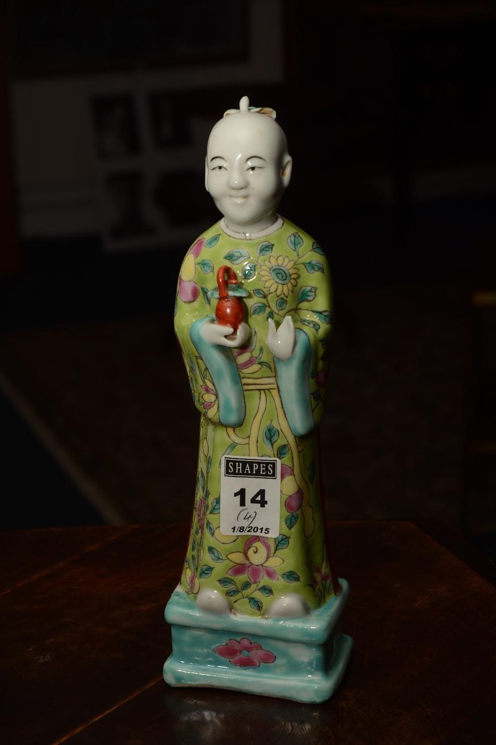 A Chinese glazed pottery figure of a monk holding vase, in green glazed floral gown, 23cm high, - Image 2 of 8