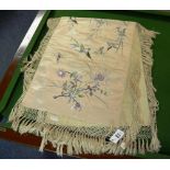 An Oriental embroidered silk, decorated with birds, butterflies and flowers,