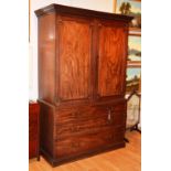 A 19th century mahogany linen press,