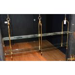 Two sets of brass effect hanging shelves,