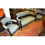 An Edwardian mahogany drawing room suite, comprising of settee and matching armchairs,