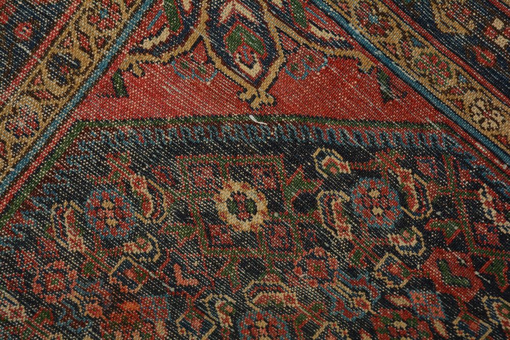 An antique Persian Malayer rug, the central rosette over blue foliate ground, with spandrels and - Image 5 of 5