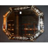 A Venetian glass wall mirror of octagonal form, with foliate panels to frame,