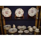 Twelve early 20th century similar Dresden porcelain fruit plates, also with similar comport and four