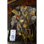 A quantity of vintage hat pins and collectables, to include various buckles,
