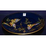 A Crown Devon Fieldings lustre circular wall plate,