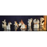 A quantity of ceramic dog figures, to include Crown Devon and Sylvac,