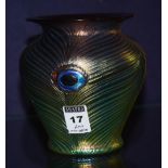 A Loetz style oviform iridescent glass vase, decorated with Ruskin style roundels, 13cm high