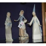 Three Lladro figures, comprising of a fairy, girl with dog and girl with flowers, 23,