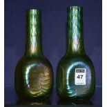 A pair of Loetz style iridescent glass vases, with moulded ripple decoration,
