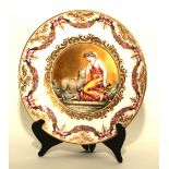 A porcelain circular plate by Naples, decorated with Classical female and sheep to centre,