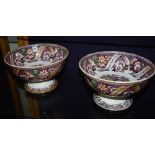 Two Victorian Alexandria Pottery punch bowls, raised on circular foot,