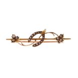 Victorian 15 ct. gold and seed pearl bar brooch with central horseshoe and leaf either side