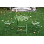 Green metal patio table and two chairs Worldwide shipping available: shipping@sheppards.ie