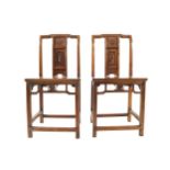 Pair of nineteenth century Chinese hardwood ceremonial chairs each with a profusely carved