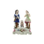 Nineteenth-century China group Young man and young girl, each seated beside a spill vase 20 cm wide;