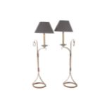 Pair of French designed polished steel and leather standard lamps and shades Worldwide shipping