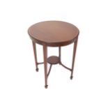 Edwardian period mahogany and satinwood cross banded occasional table the circular top, above a