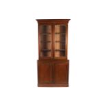 Nineteenth-century mahogany bookcase the superstructure with a mouled crown, above two gently arched