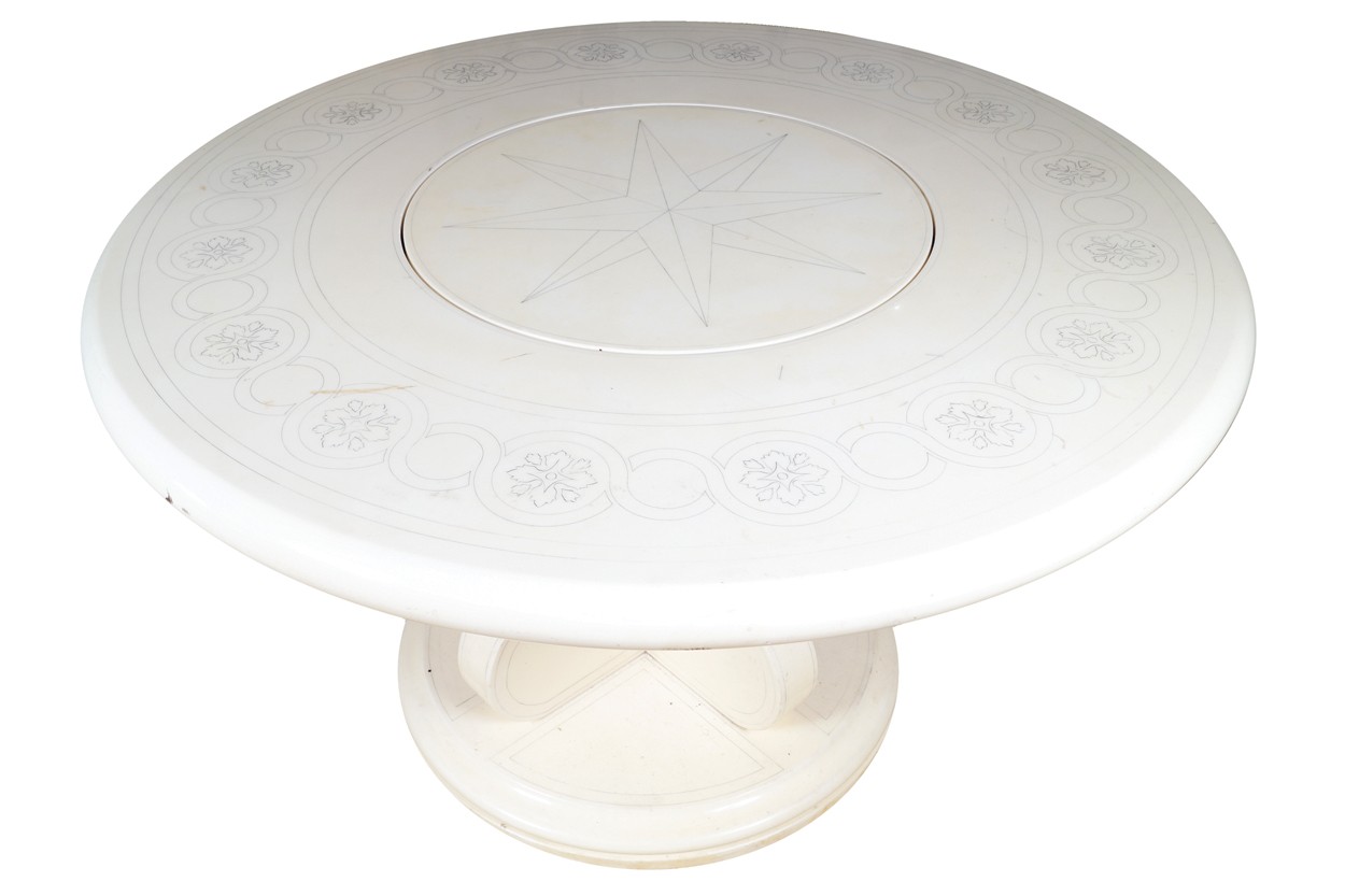 French designer circular dining table the top with inset lazy Susan, raised on a pod base