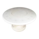 French designer circular dining table the top with inset lazy Susan, raised on a pod base