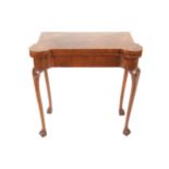 Edwardian George II style burr walnut and cross banded fold over games table raised on cabriole