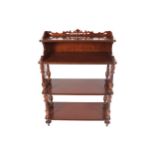 Walnut three tier what-not raised on pierced panelled and turned pillared ends Worldwide shipping