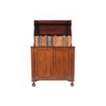 Regency period mahogany bookcase the superstructure with a waterfall front, above a projecting