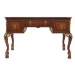 Edwardian period burr walnut and parcel gilt Queen Anne style library table the rectangular tooled