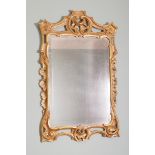 EIGHTEENTH-CENTURY CARVED GILTWOOD PIER MIRROR the rectangular bevelled mirror with serpentine