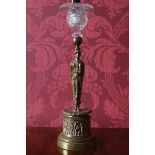 ﻿REGENCY PERIOD BRONZE AND CRYSTAL CANDLESTICK ﻿with a figural sphinx stem, raised on an acanthus