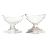 TWO EARLY NINETEENTH-CENTURY IRISH PENROSE GLASS SALTS each of oval bateau form, raised on a lozenge