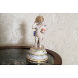 MEISSEN PORCELAIN FIGURE of a cherub holding a heart in one hand Direct all shipping enquiries to